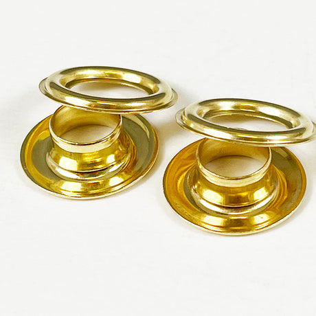 Close up image of gold colored brass grommets