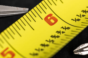 Close up of yellow ruler alignment tool.