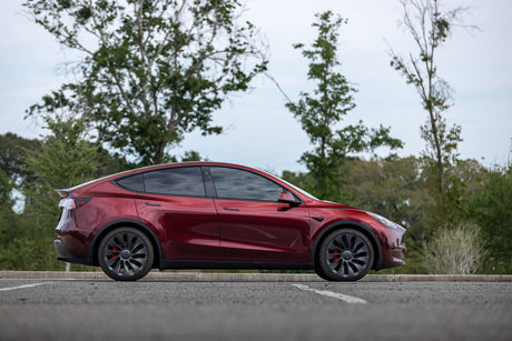 KPMF K75000 Series Premium Iridescent Wrapping Cast Vinyl Red Black Iridescent Wrapped Tesla Model Y on a road with trees in the background