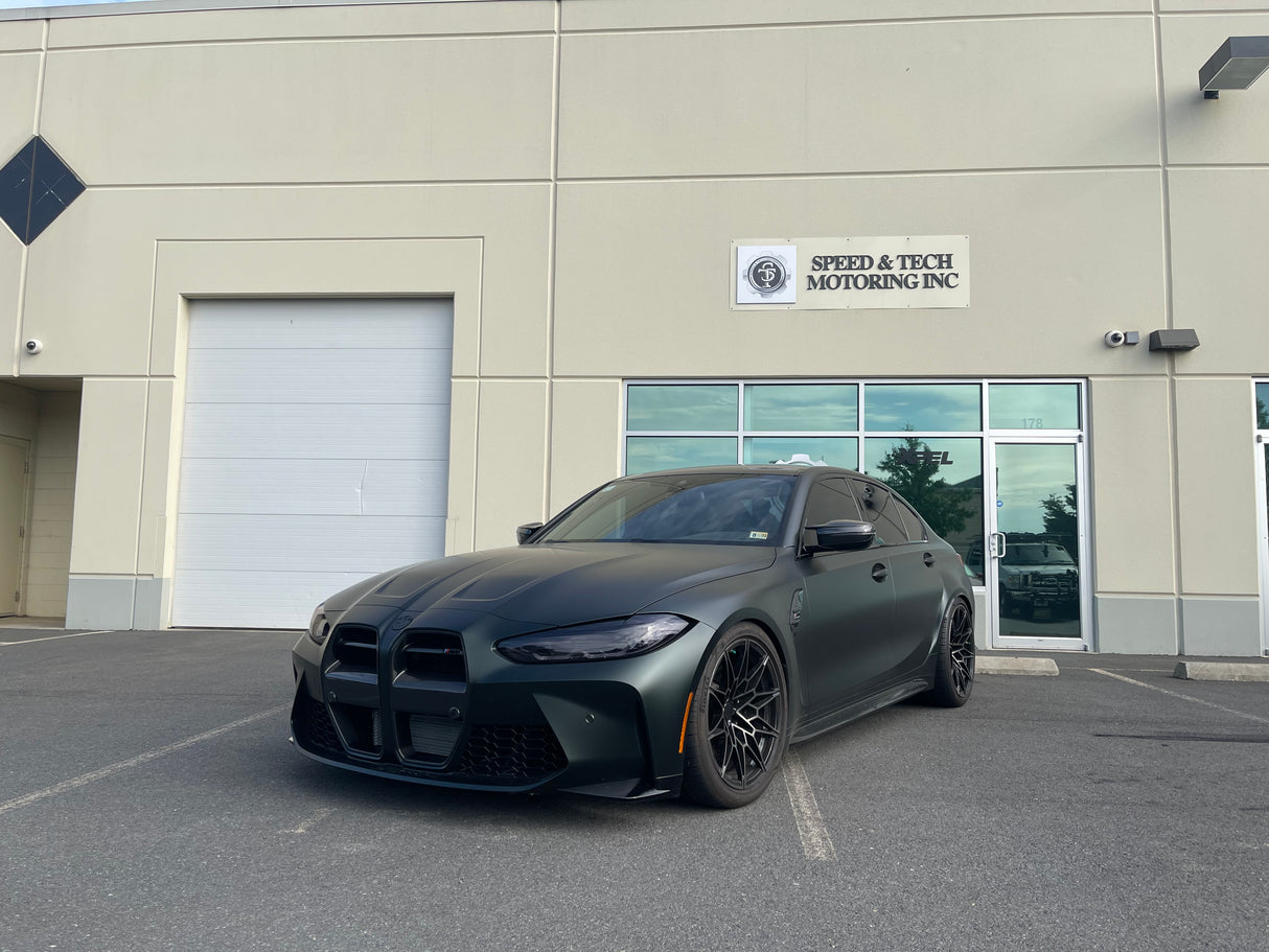 KPMF K75000 Series Premium Iridescent Wrapping Cast Vinyl Matte Platinum Dark Sage wrapped BMW car parked in front of a building with 'Speed & Tech Motoring Inc.' sign.